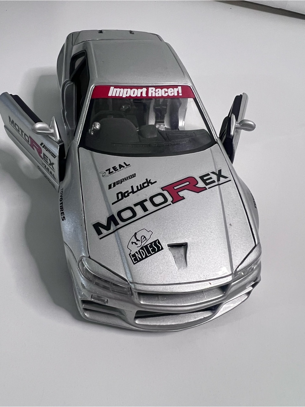 Nissan Skyline GT-R R34 Import Racer MotoRex Diecast 1:18 Escala - Coleccionable